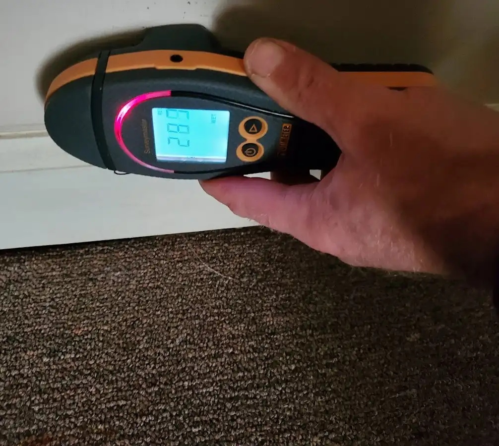 Moisture detection at baseboard during Storm Damage Restoration in Griswold